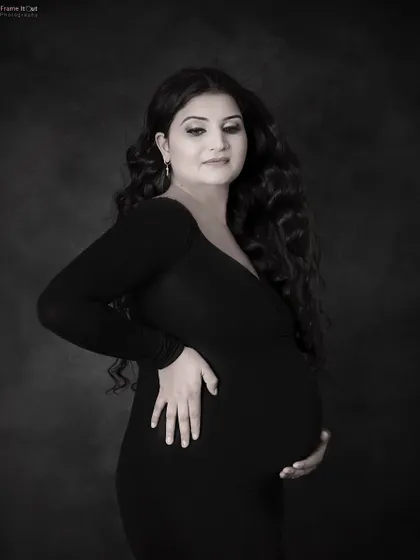 A classic and timeless black and white maternity portrait. This simple, elegant shot focuses on the beautiful silhouette and the mom-to-be's serene expression.