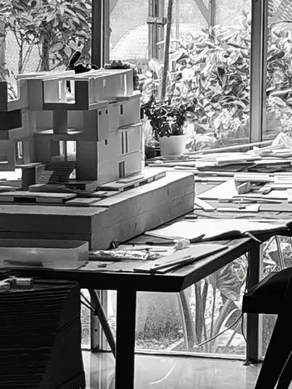 A work-in-progress model on the studio table, surrounded by the tools and materials of its creation. Our studio is a workshop where ideas are constantly being built, tested, and refined.