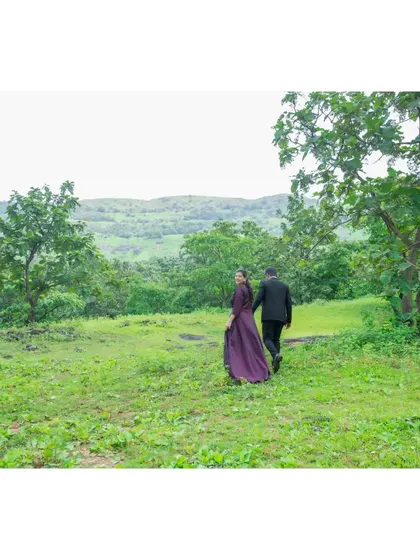 The couple walks away into the beautiful, expansive landscape, symbolizing the start of their journey together.