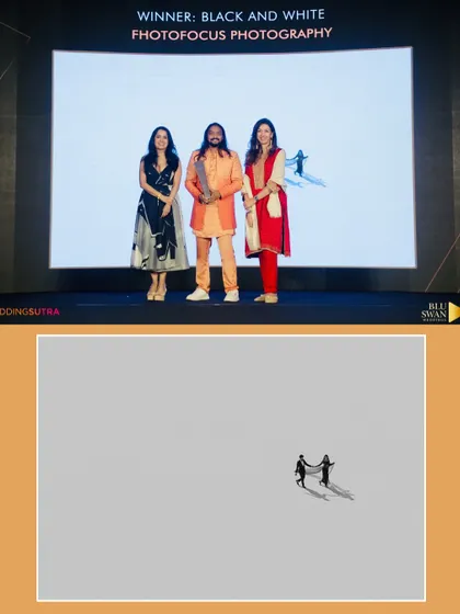 Accepting the winner's trophy for Black and White Photography. The nominated image, a minimalist aerial shot, highlights our love for creating art that is both simple and profound.