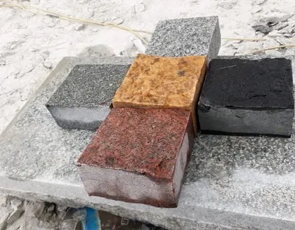 I offer cobblestones in a variety of natural colors, including red, yellow, black, and grey granite. This allows for custom patterns and designs to match any home's exterior.
