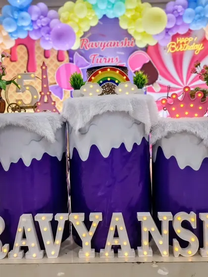 A close-up of the custom pedestals and light-up name for the Candyland party.