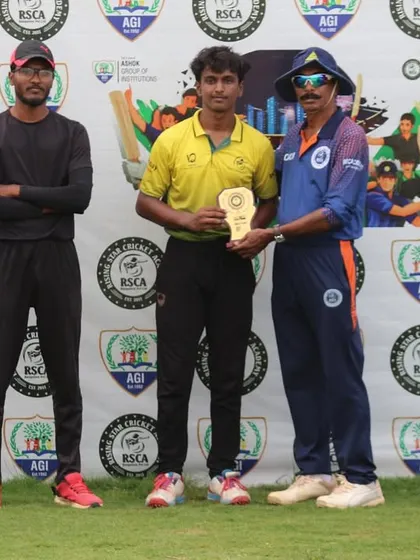 Another player is recognized for his outstanding performance with a trophy during the tournament's award ceremony.