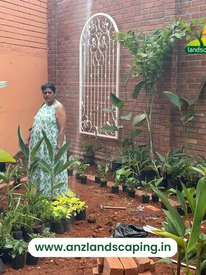 The same client on-site, involved in the creation of her exotic garden, ensuring her vision is brought to life.