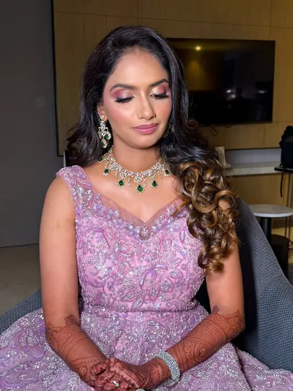 A close-up portrait, focusing on the soft and romantic makeup.