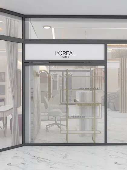 The exterior of our salon, showcasing our partnership with L'Oréal Paris. We are committed to using trusted, professional brands for all our hair services.