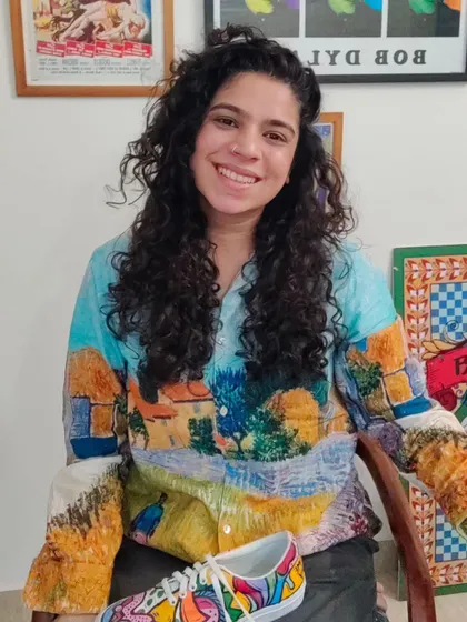 A candid shot of me in my studio, surrounded by my art and tools. This is my happy place.