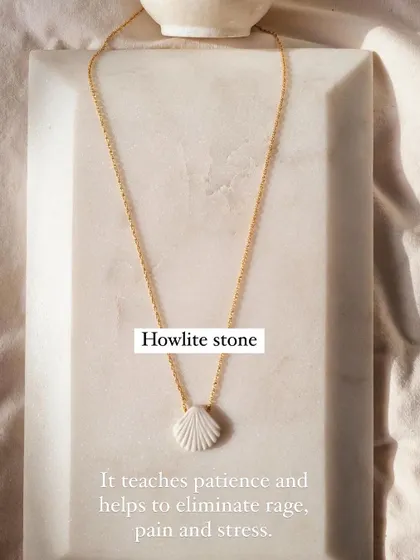 Another view of the Howlite Shell Pendant. Its purpose is to teach patience and help manage stress and anger, making it a powerful healing tool.