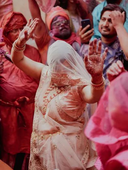 A comprehensive photo series from Lathmaar Holi in Barsana. These images document the unique tradition where women playfully hit men with sticks, recreating a legend of Lord Krishna and Radha. The photos are filled with motion, color, and raw emotion.