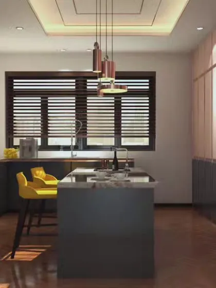 This kitchen design features a striking contrast between dark lower cabinets and lighter, wood-toned upper cabinets. The island with bright yellow stools adds a pop of color, creating a vibrant and contemporary space for cooking and socializing.