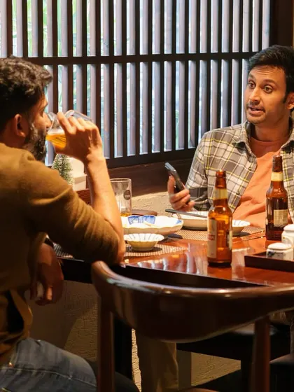 Friends sharing a drink and conversation at Ebisu. Our restaurant is a place to connect and create memories over authentic Japanese food and drinks.