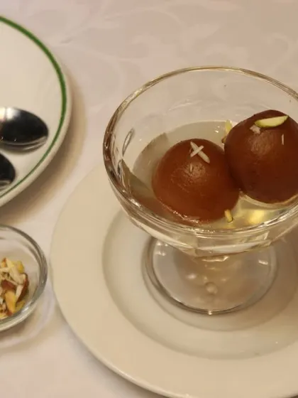 Savour the melt-in-your-mouth goodness of Gulab Jamun, a classic Indian dessert that is soft and syrupy.