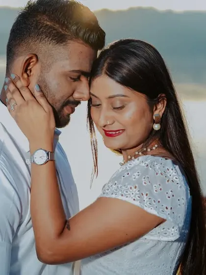 A detailed close-up capturing the couple's loving expressions during their lakeside pre-wedding shoot.
