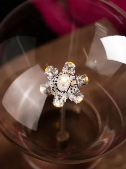 A detailed close-up of the energy-efficient LED filament inside the FLYTE light bulb. This view showcases the intricate craftsmanship and technology that powers the wireless, magical glow of the bulb.