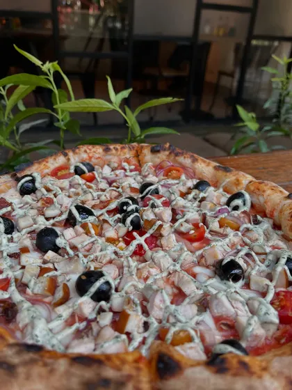 No drama, just pizza. Our smoked chicken pizza is here to make your day better.
