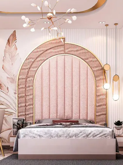 This multi-functional room serves as both a bedroom and a study. The design features a stunning arched headboard in pink upholstery, with a seamlessly integrated desk and shelving unit for a cohesive look.