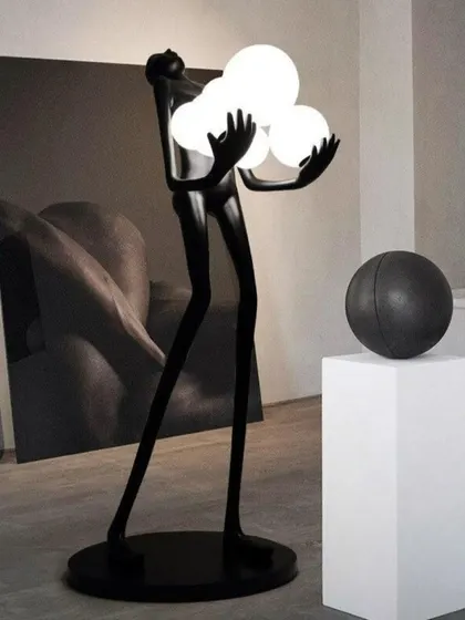 This floor lamp showcases a dynamic human form crafted from high-quality fiberglass resin, holding a trio of glowing orbs. It is a perfect example of how we merge sculpture with LED technology to create dramatic, artistic lighting.