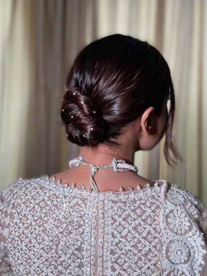 A slightly different angle of the Swarovski knot bun. You can see how the light catches the crystals. This is a great hairstyle for an evening event or a modern bride.