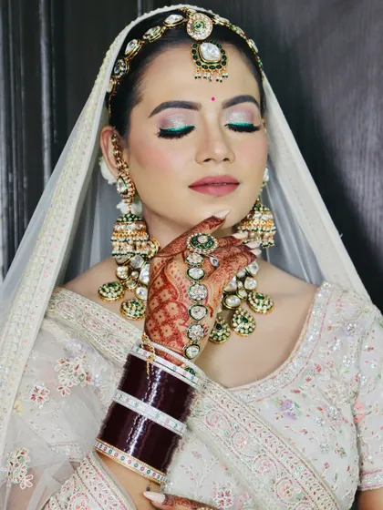 A close-up with eyes closed, giving a perfect view of the blended eyeshadow and winged liner.