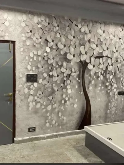 A beautiful 3D wallpaper featuring a tree with white blossoms. The grayscale design with embossed flowers adds texture and a sense of romance to this bedroom.