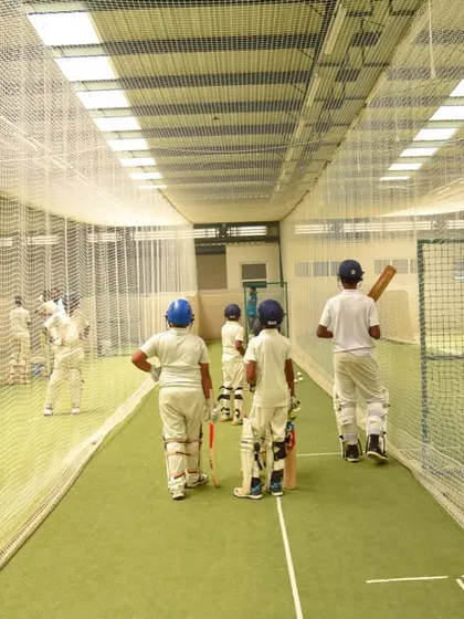 A view from inside our indoor nets, where young cricketers line up for their turn to bat. This is where technique is honed and confidence is built, one ball at a time.