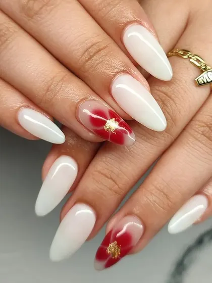 Another view of these elegant milky white nails with a beautiful red floral accent.