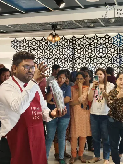 Our instructor demonstrates a flair move to an amazed audience during a workshop. We mix education with entertainment to keep our sessions engaging.