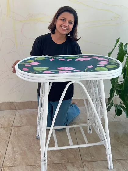 Proudly presenting a refurbished cane table, where I hand-painted a lotus pattern on the top to give it a fresh, botanical feel.