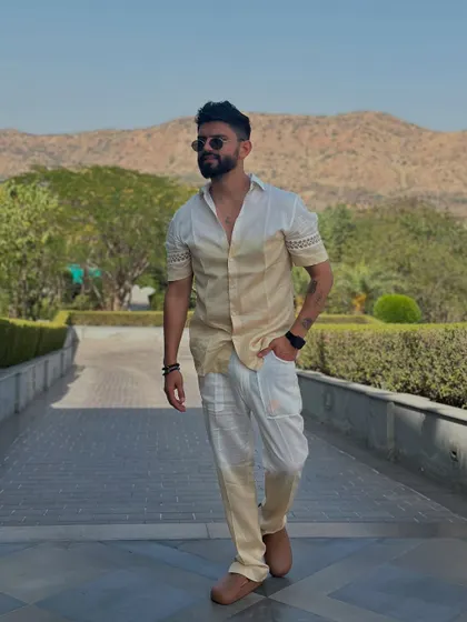 A stylish two-tone outfit against a beautiful mountain backdrop. Perfect for a destination event.