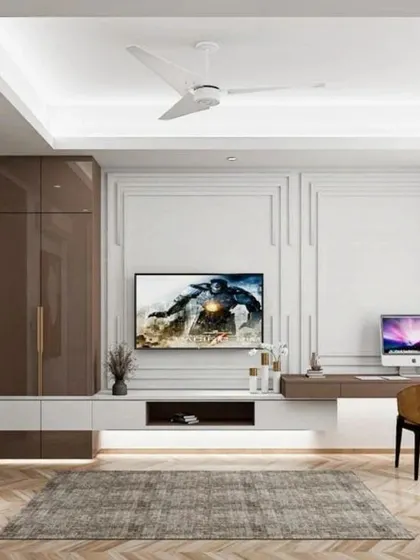 A multi-purpose bedroom with a full-wall entertainment unit, integrated storage, and a dedicated workspace.