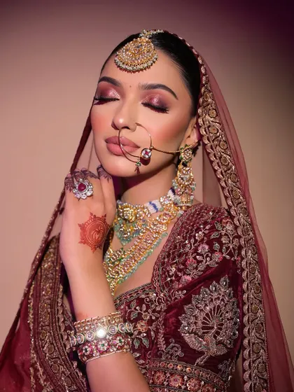The eyes are the focus here. A close-up of the red shimmer eyeshadow, blended to perfection for a look that is both traditional and glamorous.