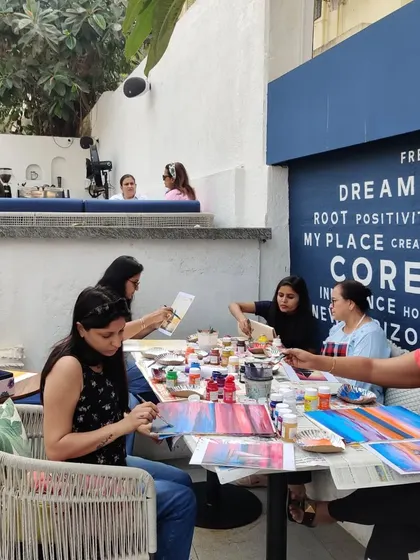 A wonderful view of my adult art class in session at a cafe. It is a great way to socialize, relax, and create together.