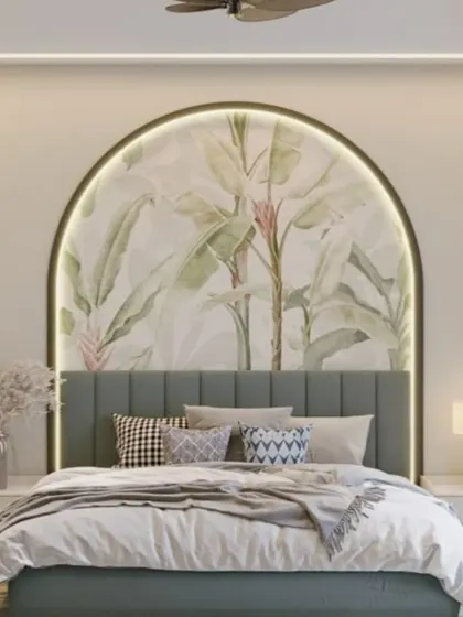 This design brings the outdoors in with a beautiful botanical mural set within a backlit arch. The light green headboard and crisp white bedding enhance the fresh, natural feel of the space.