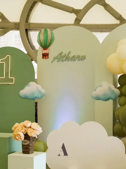 A serene and stylish hot air balloon theme in a sage green aesthetic. The clean lines and minimalist colors create a modern and sophisticated look for a first birthday celebration.