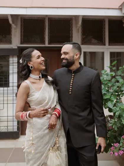 A candid moment of laughter and love. This photo perfectly captures the couple's happy and relaxed chemistry after their engagement ceremony.