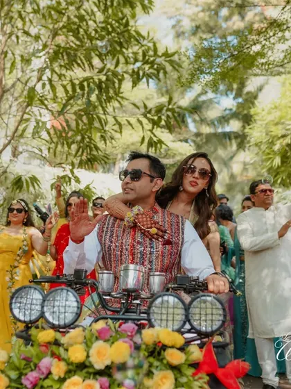 The bride's squad cheering them on with money guns during their fun Haldi entrance.
