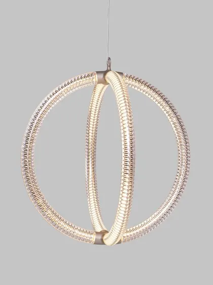 A studio shot of the Luminora pendant, highlighting the intricate, V-shaped diamond pattern on its surface. This detail shows the complexity and elegance that is achieved through its seemingly simple circular form.
