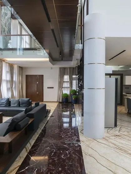 This is a duplicate of ID 61. The living area of this residence is defined by its bold use of materials, including two types of striking marble.