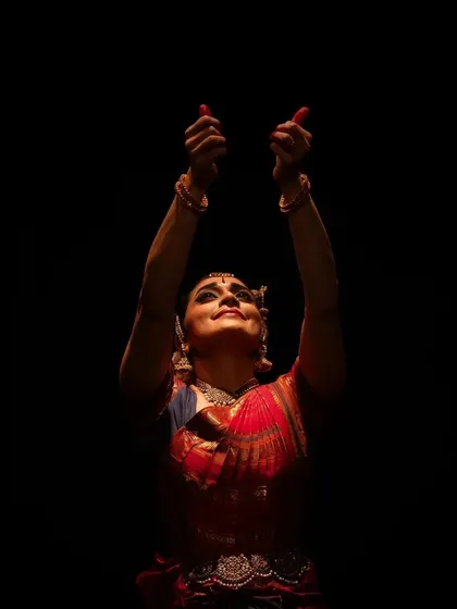 A moment of devotion, with hands raised in offering, captured at the Diaspora Dance Festival.