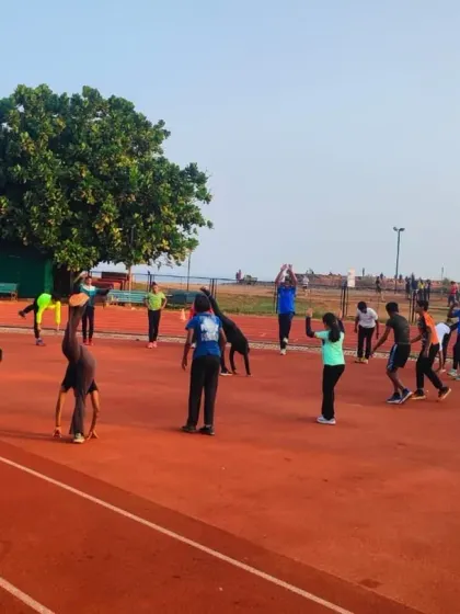 My training sessions incorporate a variety of exercises to build all-round athleticism. Here, athletes are seen doing dynamic stretches and movements to improve flexibility and strength.