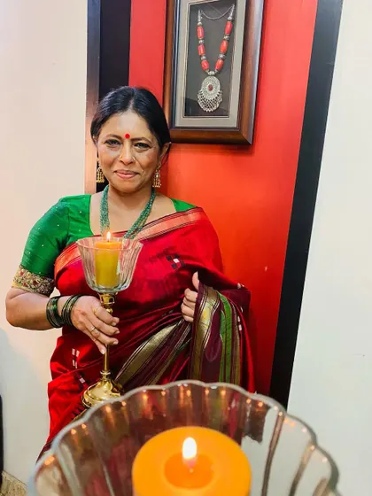Celebrating the festival of lights in my red dupion silk saree. Red symbolizes passion and love, perfect for Navratri.