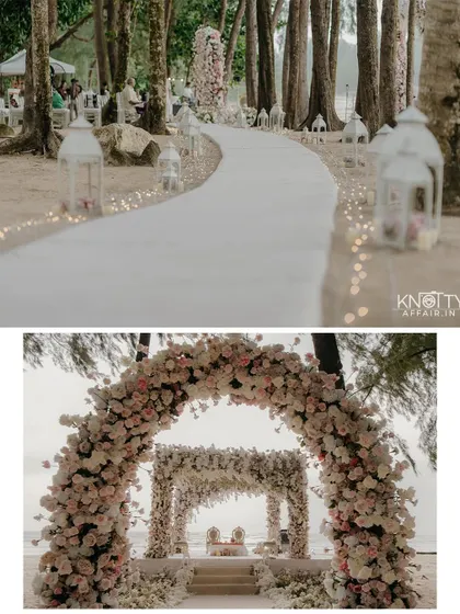The stunning decor of the Thailand beach ceremony. The floral archway and lantern-lined aisle create a magical path leading to the mandap, perfectly blending elegance with the natural tropical setting.