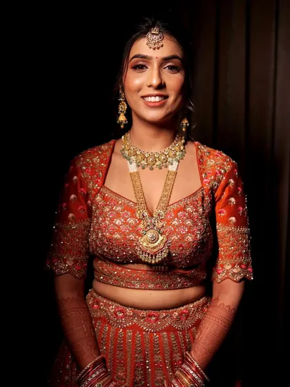 A full-body shot of the bride, showing how the makeup and styling come together to create a cohesive and stunning look.