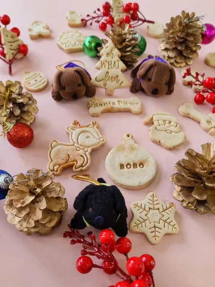 A festive spread of my gluten-free Christmas biscuits. I make them in all sorts of fun shapes like snowflakes, reindeer, and Christmas trees, and you can even get a personalized name tag biscuit.