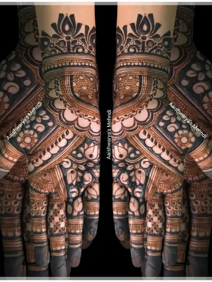 A bold and beautiful back-hand design featuring large lotus motifs and intricate finger details. This style makes a statement.