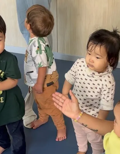 Toddlers clap and move to the music, developing their sense of rhythm.