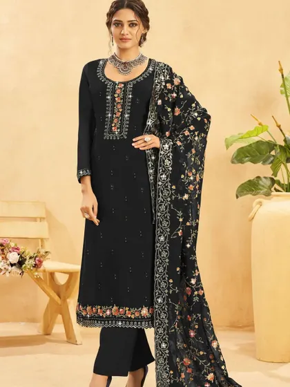 This black salwar kameez is a timeless beauty. The colorful thread embroidery and sequins on the neckline and dupatta add a pop of festive cheer to the classic black.