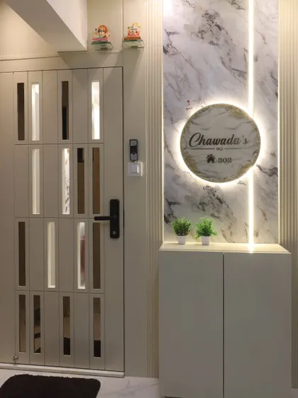 Another angle of the Bhayandar entrance, showing the complete look with the door, nameplate, and shoe cabinet. The vertical lighting strip adds a touch of modern sophistication.