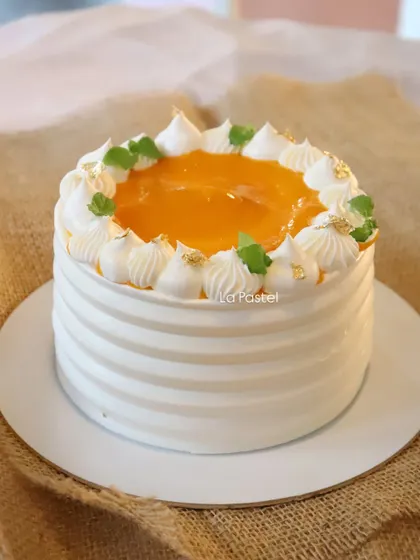 My seasonal 'Aamras' cake! It's a light vanilla cake filled and topped with fresh mango pulp, perfect for summer.