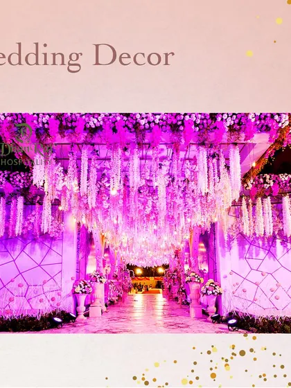 An elegant entrance illuminated in purple light. We use a combination of floral arrangements and dramatic lighting to make our outdoor decor a masterpiece in every detail.